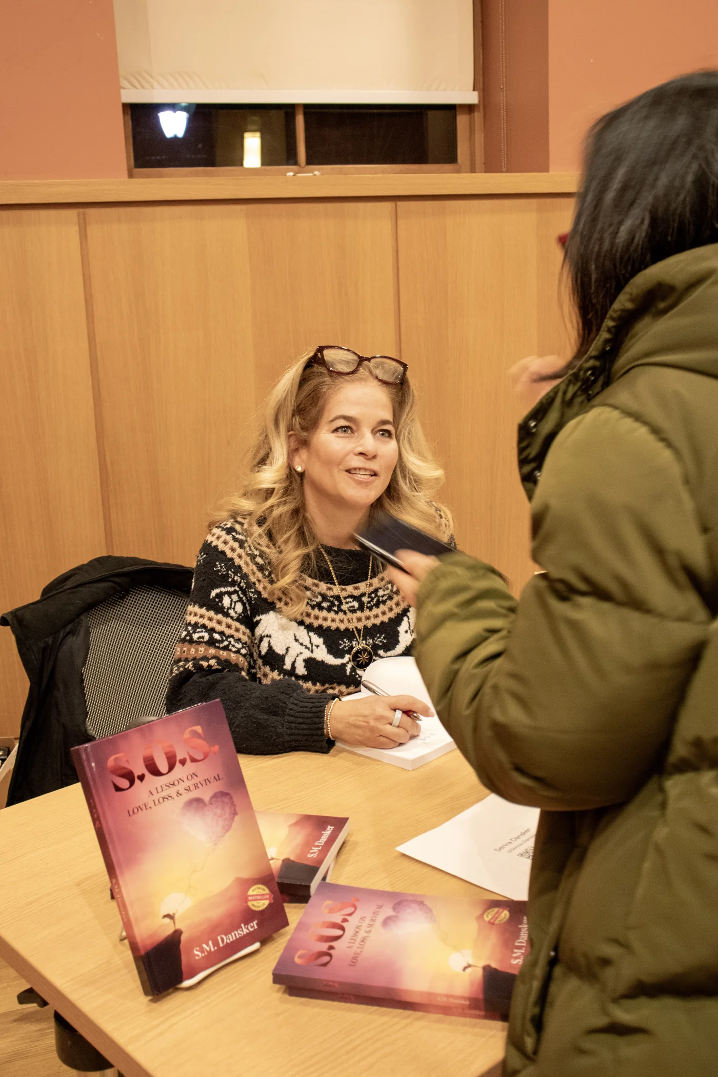Serina Dansker signing copies of her S.O.S. memoir