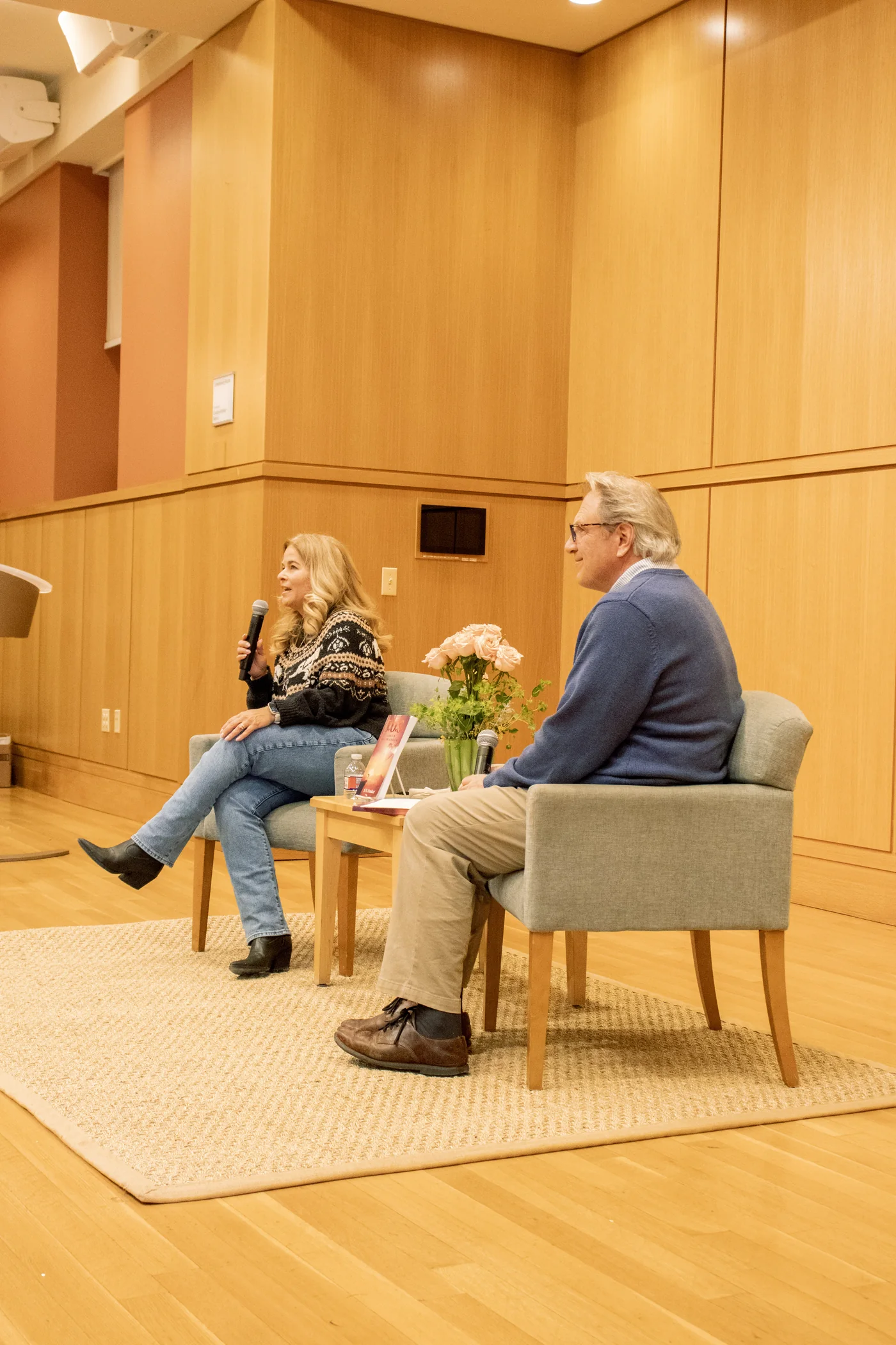Serina Dansker speaking onstage during an interview
