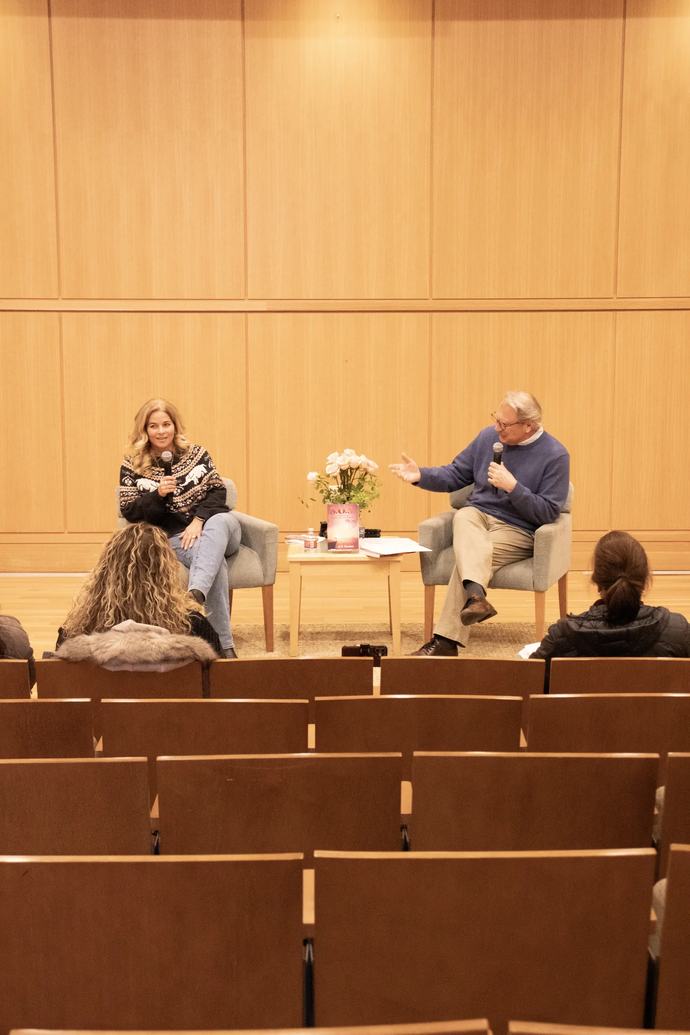 Serina Dansker speaking with an interviewer at a public event